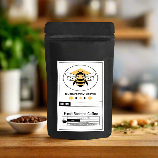 Bag of Buzzworthy Brews House Blend Medium Roast Coffee, featuring nutty, sweet chocolate, and citrus notes. A smooth, clean blend from Central & South America.